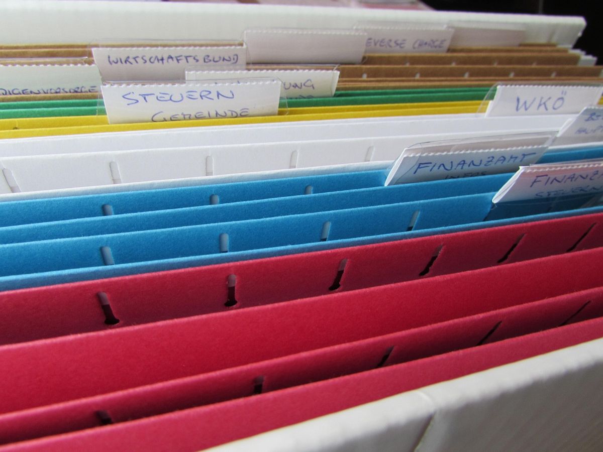 Colorful hanging file folders in a drawer